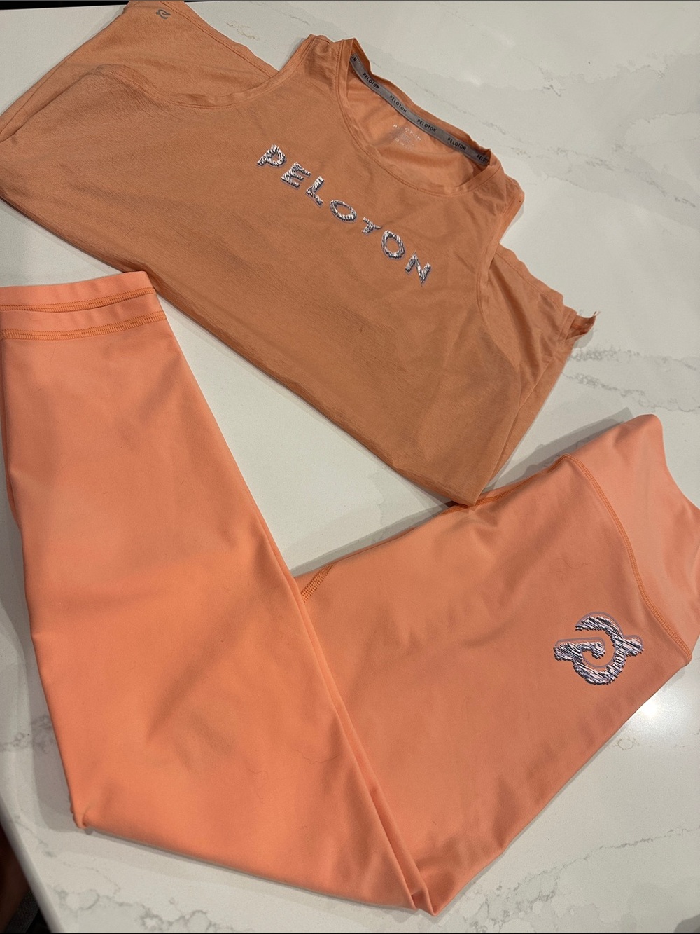 Peloton Orange matching set size large pants and small tank top